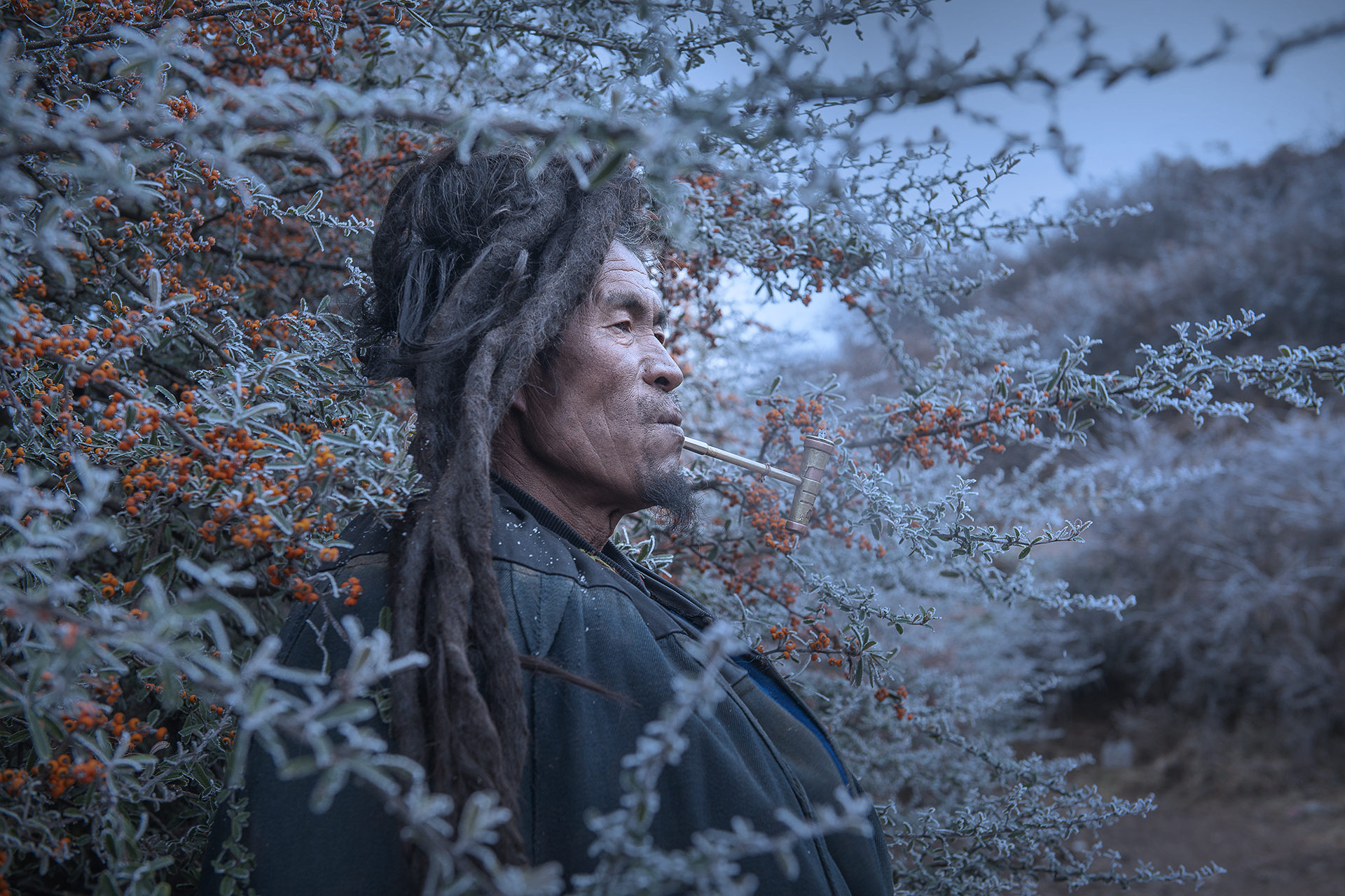 Yanrong Guo won the People category for her striking image Miss taken of a pipe-smoking man in Liangshan Yi Autonomous Prefecture, the largest settlement of ethnic minority Yi people in China.​ Photo: Yanrong Guo/Earth Photo 2020/RGS