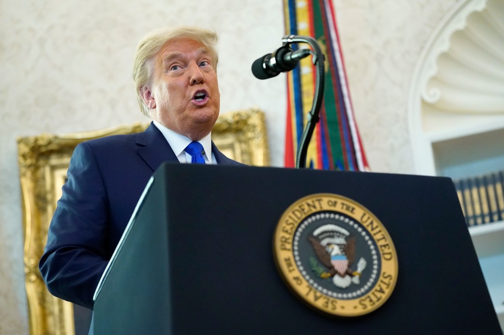 President Donald Trump speaks before awarding the Presidential Medal of Freedom in the Oval Office of the White House, Monday, Dec. 7, 2020 (AP Photo/Patrick Semansky)​