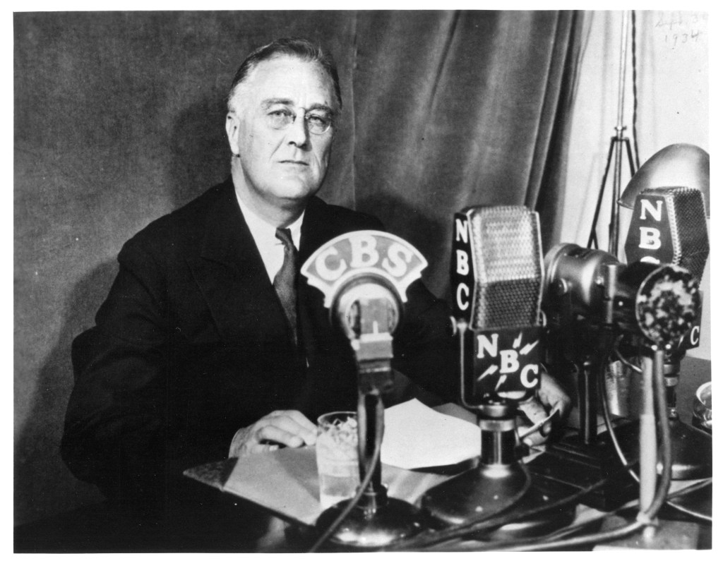 FDR in front of radio microphones.