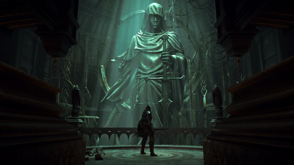 Screenshot from Demon's Souls, a player stand in front of a large statue of a woman holding a sword in the game's hub world, the Nexus