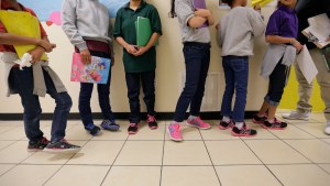 Migrant teens line up for a class at a "tender-age" facility for babies, children and teens on Aug. 29, 2019.