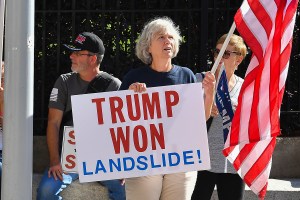 A supporter of President Trump holds a sign at a "Stop The Steal" rally in front of the Georgia State Capitol Building on November 28th, 2020 in Atlanta, GA. (Photo by Rich von Biberstein/Icon Sportswire) (Icon Sportswire via AP Images)