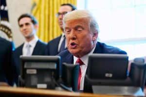 President Donald Trump speaks while on a phone call with leaders of Sudan and Israel in the Oval Office of the White House, Friday, Oct. 23, 2020, in Washington. (AP Photo/Alex Brandon)