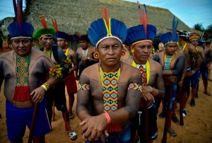 Members of the Tapirape tribe wait to perform a ceremonial dance in Mato Grosso state, Brazil, on January 17, 2020