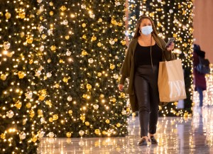 A person carries a shopping bag inside The Mall at the Hudson Yards in New York City.