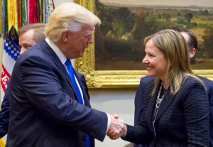 U.S. President Donald Trump shakes hands with General Motors CEO Mary Barra in January 2017.​ Photo by Saul Loeb/AFP via Getty Images