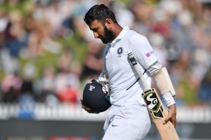 Cheteshwar Pujara walks from the field after being bowled