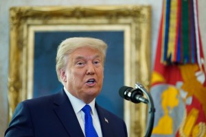 President Donald Trump speaks before awarding the Presidential Medal of Freedom, the highest civilian honor, to Olympic gold medalist and former University of Iowa wrestling coach Dan Gable in the Oval Office of the White House, Monday, Dec. 7, 2020, in W