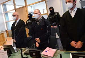 Defendant Stephan Balliet (C) arrives for what is expected to be the verdict in his trial at the Magdeburg Regional Court