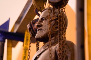 This Monday, Dec. 21, 2020 photo provided by the Office of the Governor of Virginia shows a statue of Confederate Gen. Robert E. Lee being removed from the National Statuary Hall Collection in Washington. (Jack Mayer/Office of Governor of Virginia, File)​