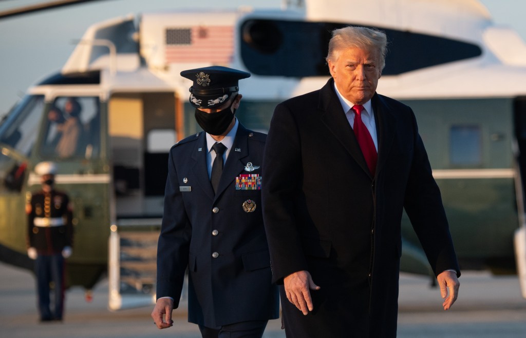 US President Donald Trump walks to board Air Force One prior to departure from Joint Base Andrews in Maryland, December 23, 2020, as they travel to Mar-a-lago for Christmas and New Year's.