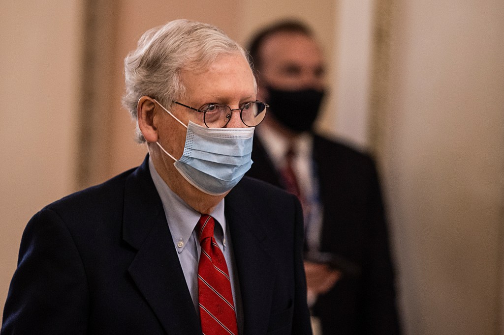 U.S. Senate Majority Leader Mitch McConnell (R-KY) walks to open up the senate on Capitol Hill on December 20, 2020 in Washington, DC.​