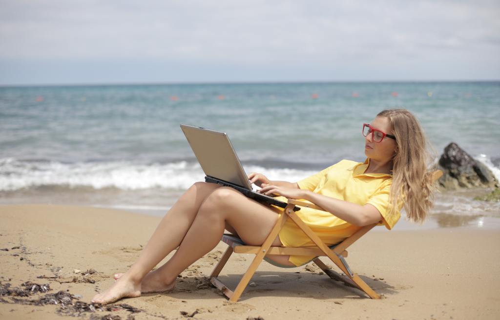 woman working beach workcation