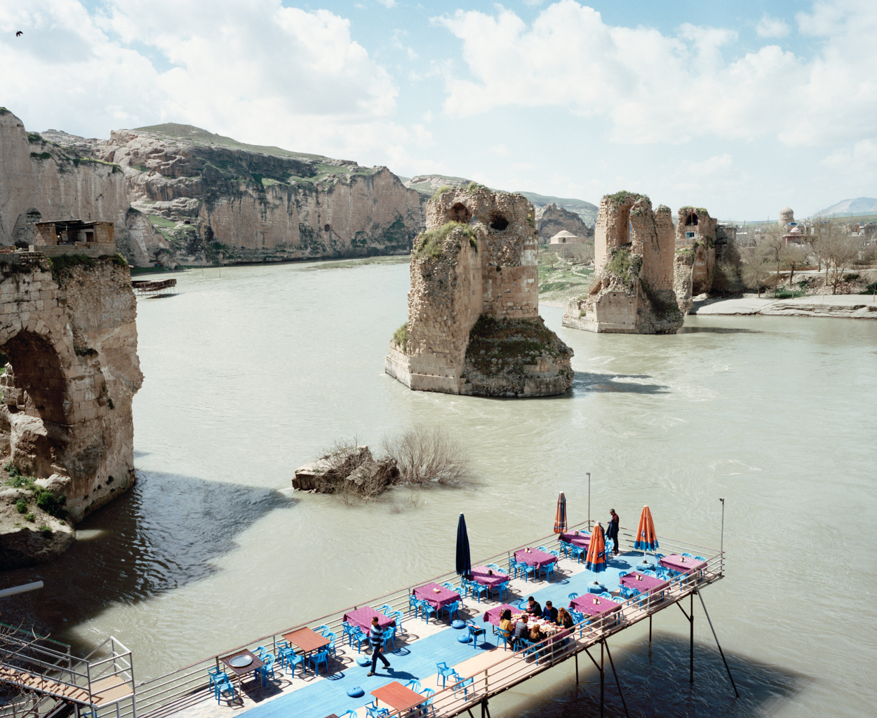 Mathias Depardon - Transanatolia. A colourful restaurant terrace suspended on stilts above the Tigris river.