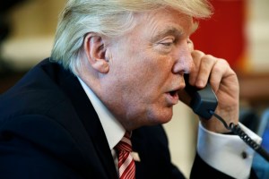 President Donald Trump talks on the telephone in the Oval Office of the White House in Washington, in file photo from June 27, 2017.