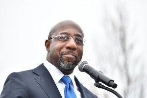 Raphael Warnock, U.S. Democratic Senate candidate, speaks during his Souls To The Polls Drive-In Rally at Riverside EpiCenter on December 20, 2020 in Austell, Georgia.