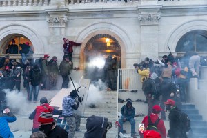 Police use tear gas around Capitol building where pro-Trump supporters riot and breached the Capitol.