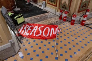 A flag that reads "Treason" is visible on the ground in the early morning hours of Thursday, Jan. 7, 2021, after protesters stormed the Capitol in Washington, on Wednesday.