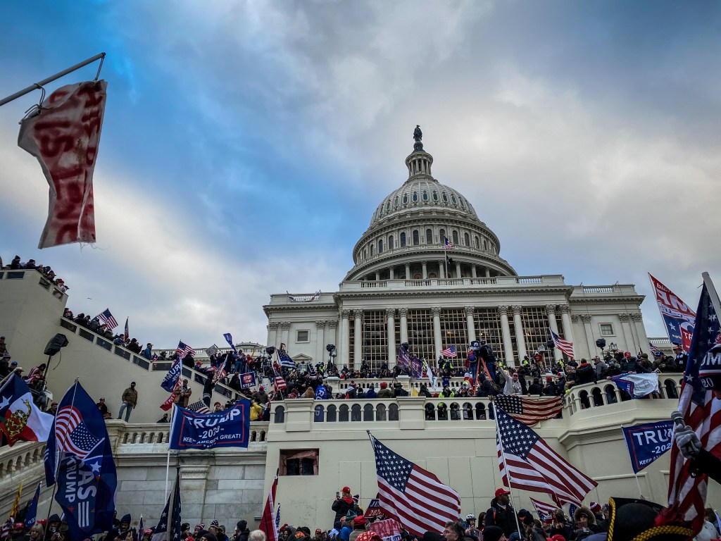 Trump supporters near the US Capitol following a "Stop the Steal" rally on January 06, 2021 in Washington, DC. The protesters stormed the historic building, breaking windows and clashing with police.