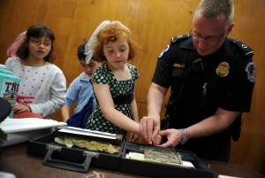 Howard Liebengood takes the fingerprints of a girl on "Kid Safety Day" in 2008. Photo: Tom Williams/Roll Call/Getty Images