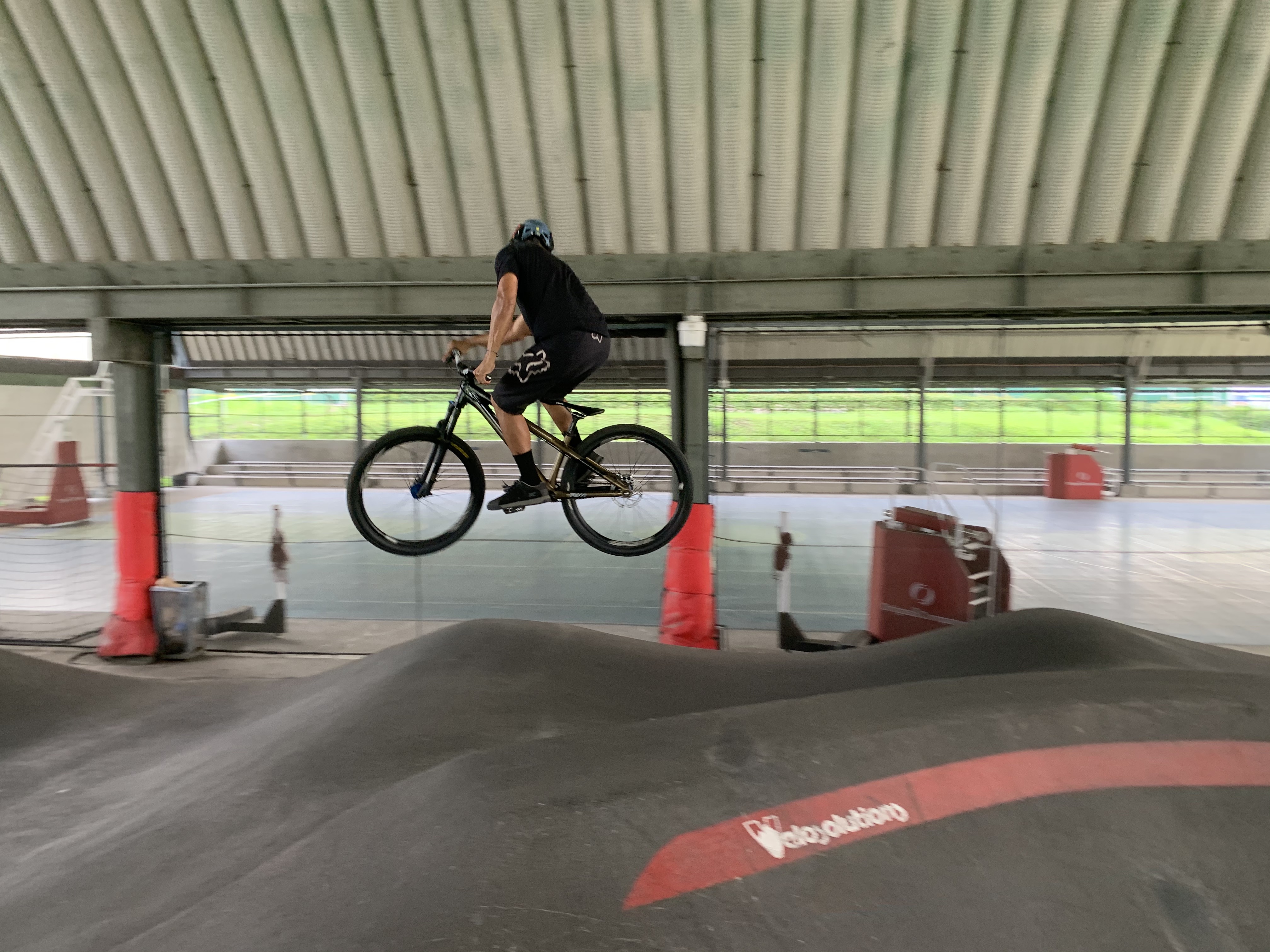 Bans Mendoza hops around on the pump track.