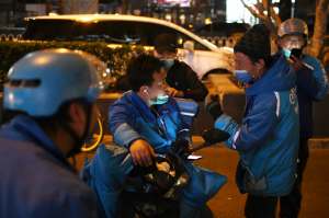 China's delivery drivers race against time to