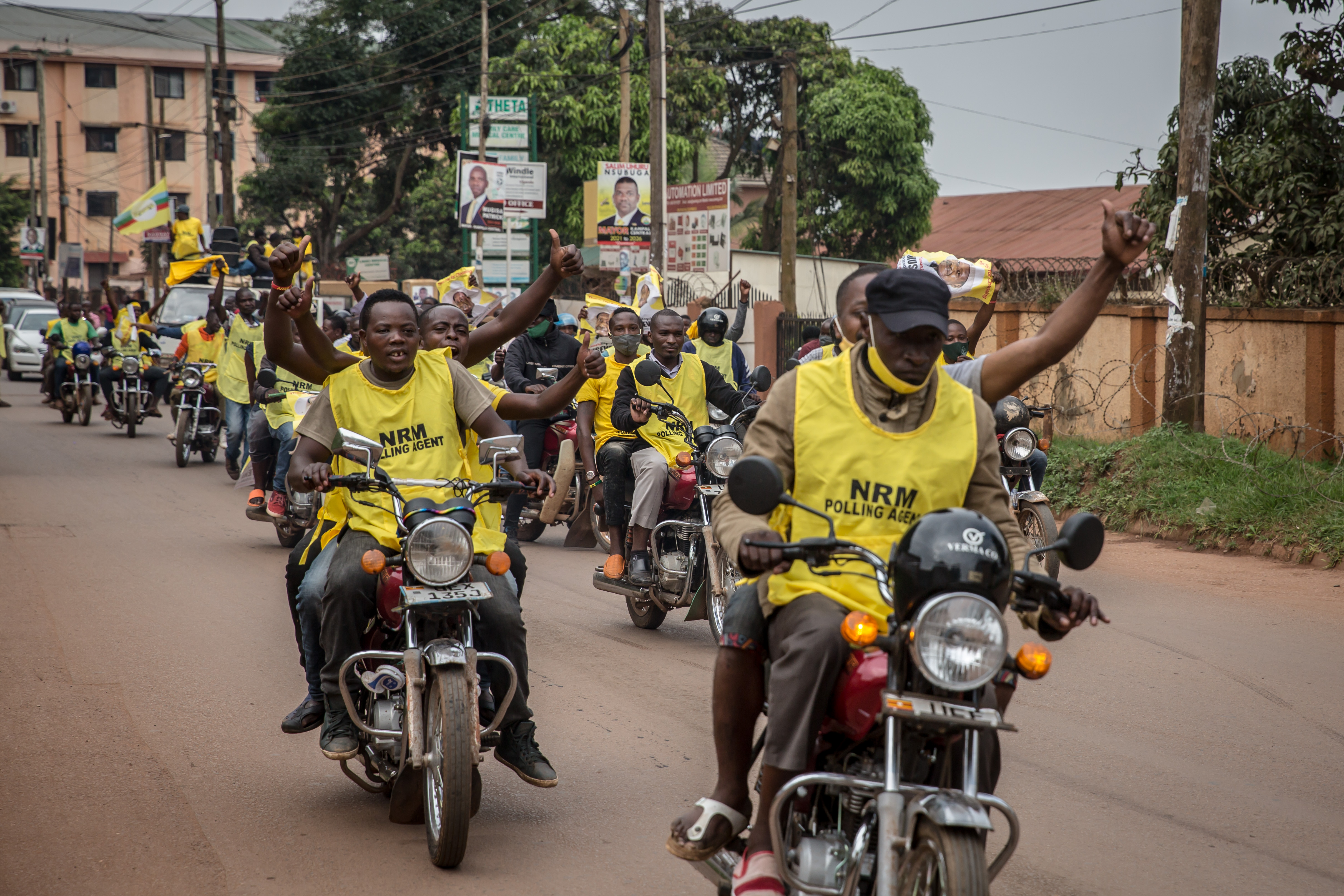 Museveni supporters celebrate on motorbike in Kampala.