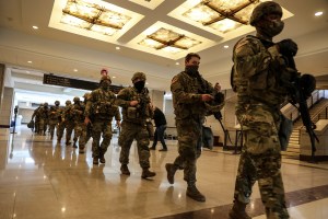 Members of the US National Guard leave the US Capitol to take positions outside after an "external security threat" prior to a dress rehearsal for the 59th inaugural ceremony for President-elect Joe Biden and Vice President-elect Kamala Harris, at the US