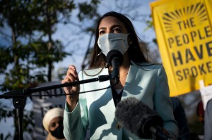 U.S. Rep. Alexandria Ocasio-Cortez calls on President-elect Joe Biden to take bold action on climate change outside Democratic National Committee headquarters on November 19​, 2020.