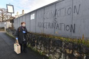 Anti-vaccination propaganda graffiti sprayed on walls around a disused pub in Telford, Shropshire