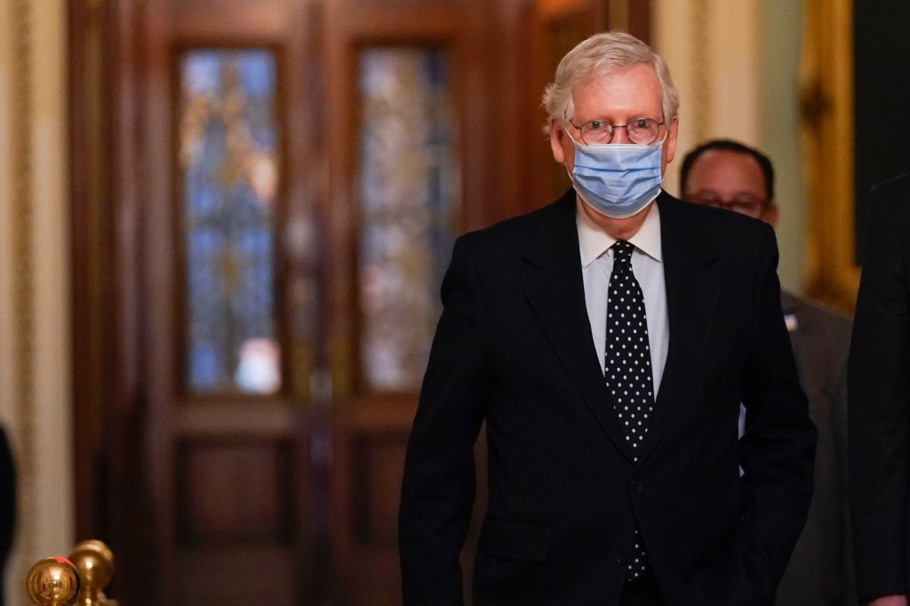 In this Jan. 6, 2021, photo, Senate Majority Leader Mitch McConnell of Ky., walks from the Senate floor to his office on Capitol Hill in Washington.