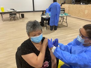 Indigenous woman gets first COVID-19 vaccine