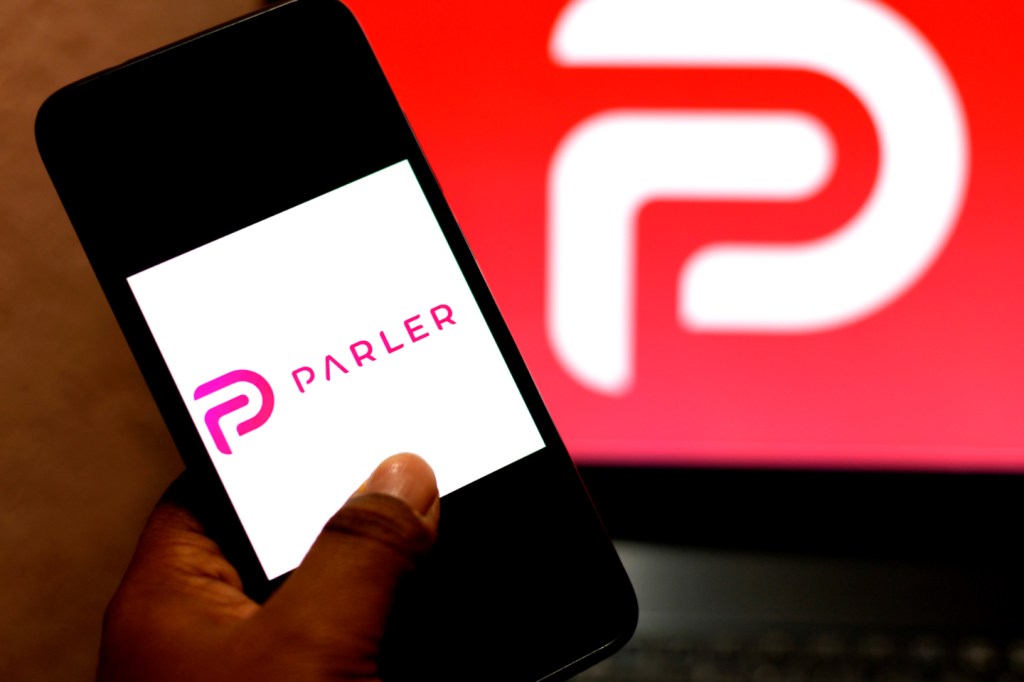 In this photo illustration, a Parler logo seen displayed on a smartphone. (Avishek Das / SOPA Images/Sipa USA)(Sipa via AP Images)​