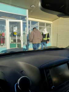 ​A man wearing a white pointed hood was spotted outside the Grimshaw, Alberta, post office on Jan. 8, 2021.