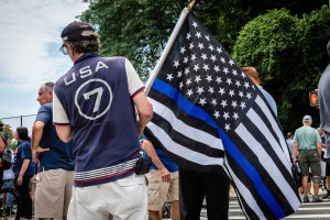 A man carrying a Thin Blue Line flag attends a Blue Lives Matter rally in Bay Ridge, Brooklyn, on July 11, 2020.