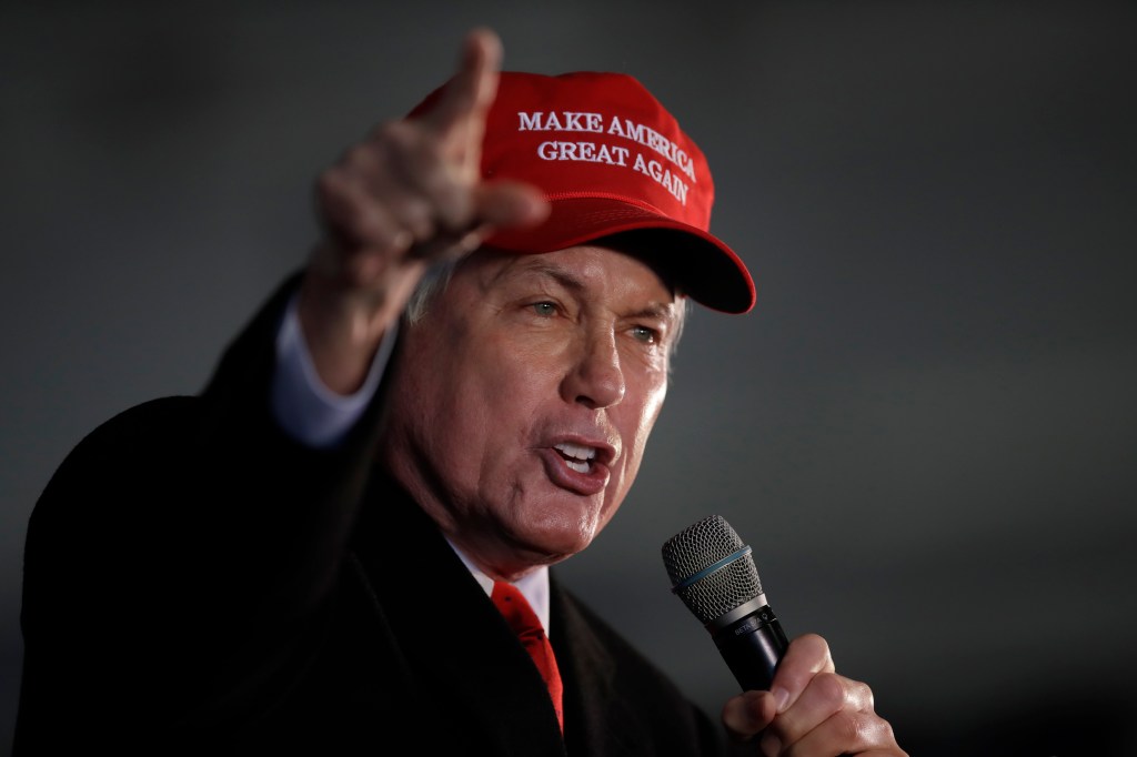 Attorney Lin Wood, member of President Donald Trump's legal team, gestures while speaking during a rally on Friday, Dec. 2, 2020, in Alpharetta, Ga. (AP Photo/Ben Margot)