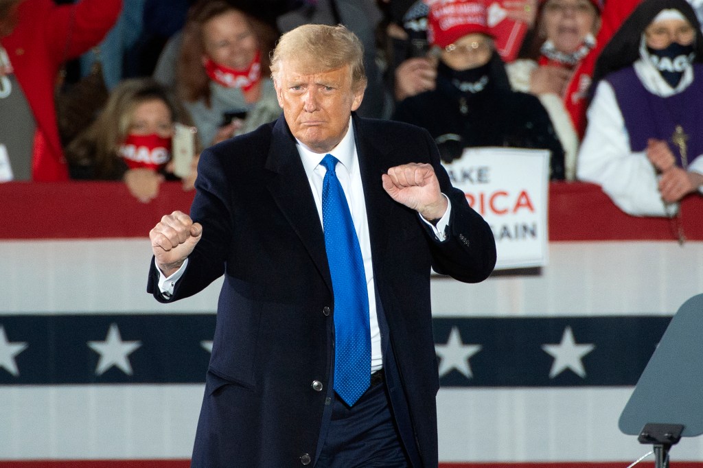 President Donald Trump does a little dance during a campaign rally at the Pickerington County Fairgrounds in Circleville, Ohio, Saturday Oct. 24, 2020. (AP Photo/Phil Long)