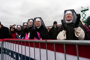 Nuns with the Dominican Sisters of Hartland, Mich., applaud as President Donald Trump speaks at a campaign rally at Oakland County International Airport, Friday, Oct. 30, 2020, at Waterford Township, Mich.