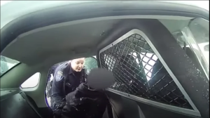 Screen Shot 2021-02-03 at 12A ROCHESTER POLICE OFFICER PUTS A HANDCUFFED 9-YEAR-OLD INTO THE BACK A CRUISER AFTER RECEIVING A CALL ABOUT A FAMILY DISPUTE.