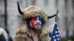 Jacob Chansley, a.k.a. Jake Angeli and the QAnon Shaman, speaks to passersby during the "Stop the Steal" rally on January 06, 2021 in Washington, DC.