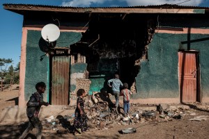 Children play in a destroyed house in Ethiopia's Tigray region