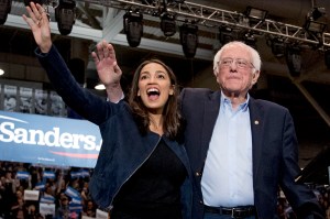 In this Feb. 10, 2020 file photo, Democratic presidential candidate Sen. Bernie Sanders, I-Vt., right, and Rep. Alexandria Ocasio-Cortez, D-N.Y. wave to supporters at campaign stop at Whittemore Center Arena at the University of New Hampshire in Durham, N