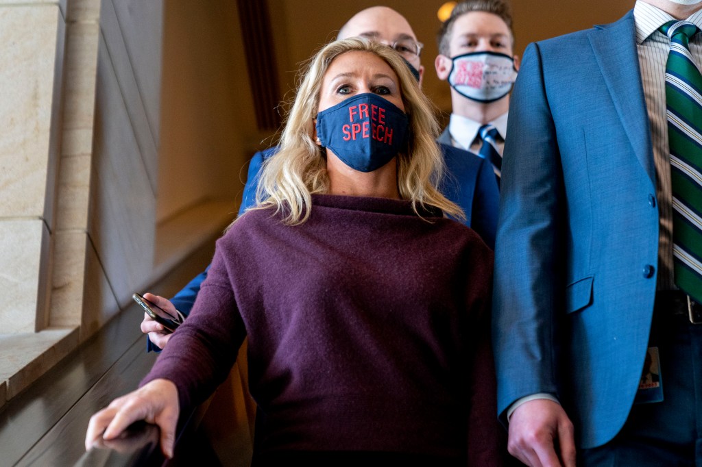 Rep. Marjorie Taylor Greene, R-Ga., goes back to her office after speaking on the floor of the House Chamber on Capitol Hill in Washington, Thursday, Feb. 4, 2021. (AP Photo/Andrew Harnik)