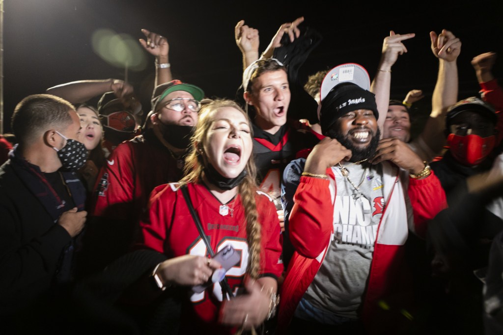 Tampa Bay Buccaneers' fans celebrate their victory outside Raymond James Stadium after winning the Super Bowl LV, in Tampa, Florida, United States on February 07, 2021.