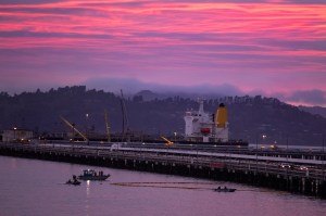 Chevron and fire-agency crews respond to a five-gallon-per-minute petroleum product leak in the waters of Point Richmond as an absorbent boom is placed next to the Chevron Richmond Long Wharf in Richmond, Calif., on Tuesday, Feb. 9, 2021.