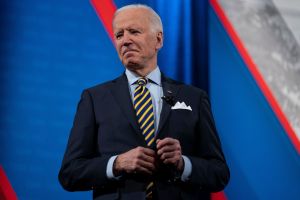 President Joe Biden talks with audience members as he waits for a commercial break to end during a televised town hall event at Pabst Theater, Tuesday, Feb. 16, 2021, in Milwaukee.