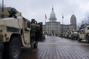 Members of the Michigan National Guard at a staging area behind the Michigan State Capitol building in Lansing, Michigan, U.S., on Sunday, Jan. 17, 2021.