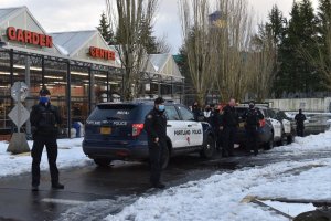 Police officers outside the Hollywood West Fred Meyer in Portland, Oregon on Feb. 16, 2021.