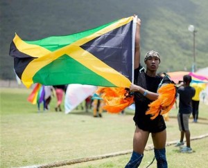 A gay-rights campaigner holds a Jamaican flag