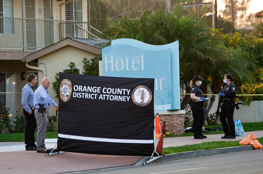 FILE - In this Sept. 23, 2020, file photo, investigators work in front of Hotel Miramar in San Clemente, Calif., after an Orange County sheriff's deputy shot and killed a Black man after he allegedly tried to grab one of their guns during a struggle, auth